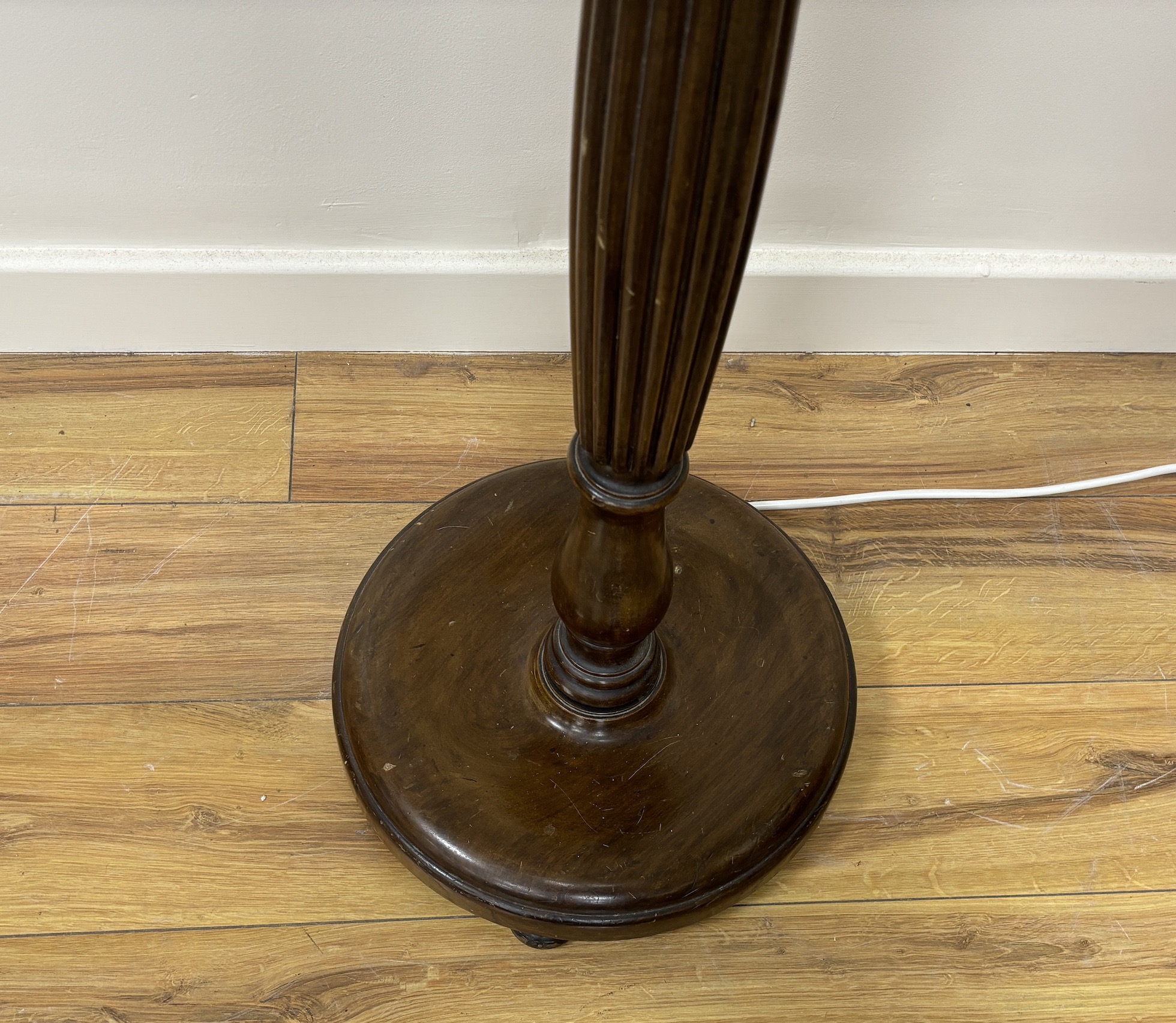 A mahogany standard lamp with shade, height including shade 170cm